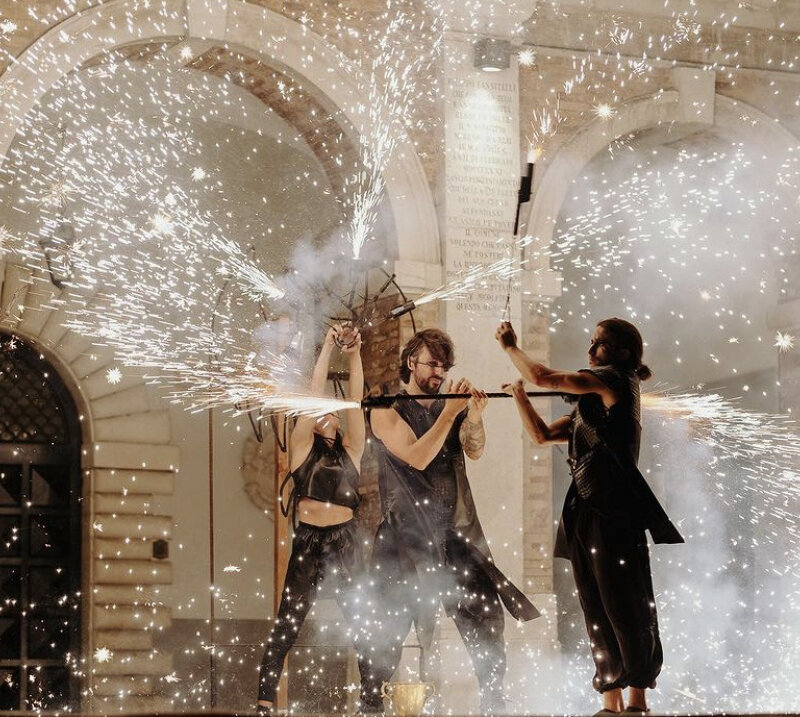 Image of three artists performing a show with fire | © Florio Angeli